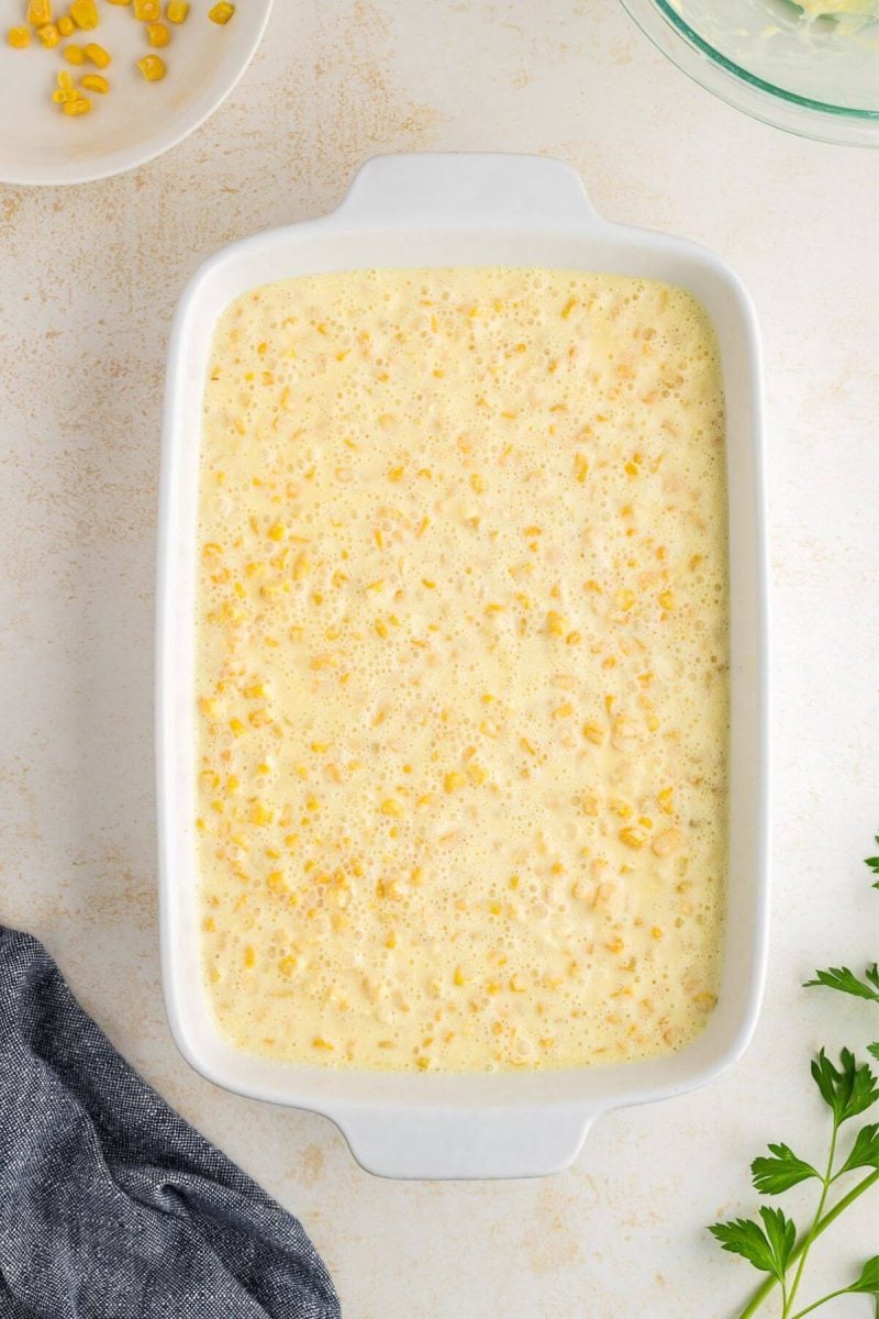 Corn pudding casserole in 9x13 inch baking dish. 
