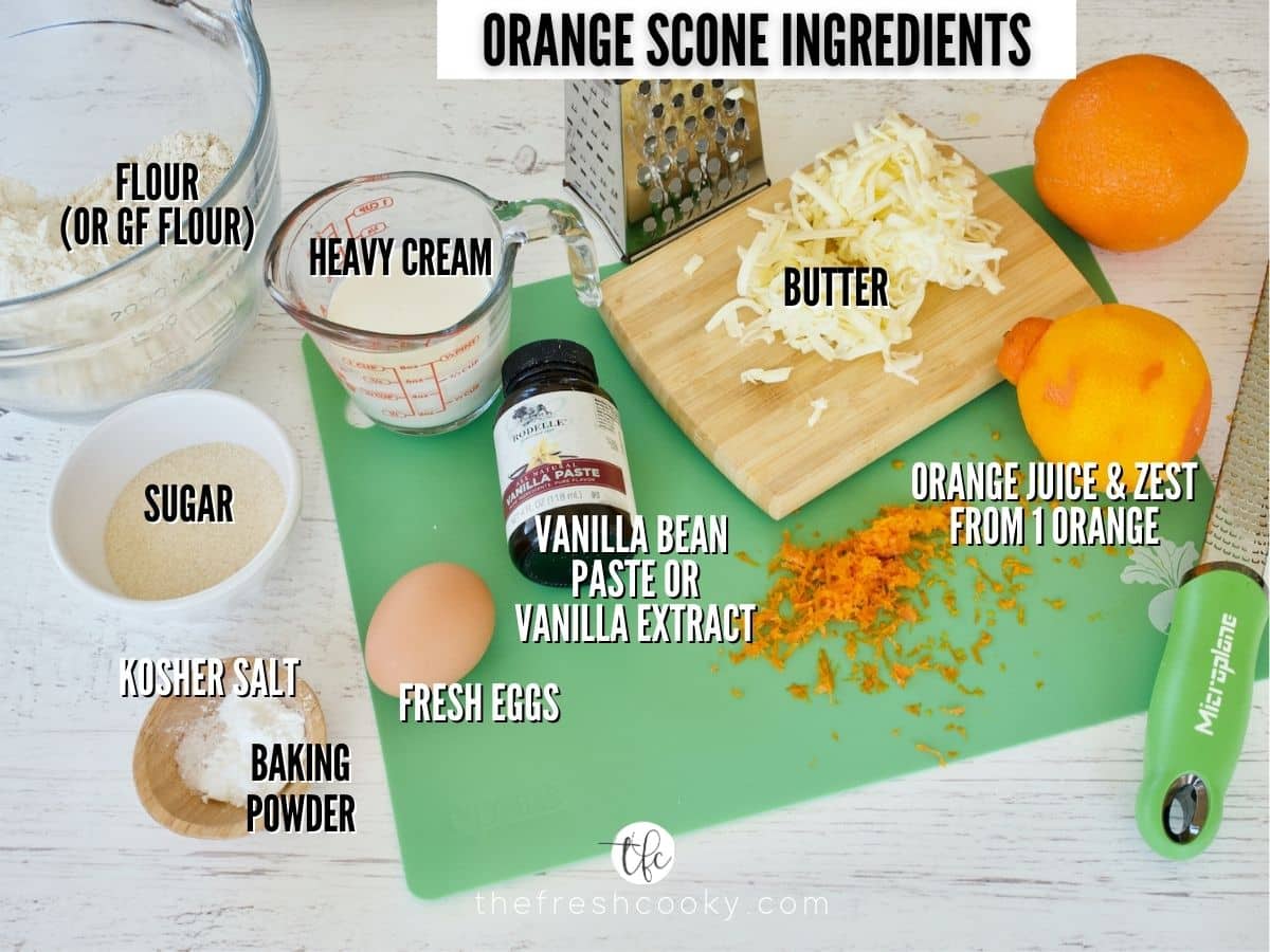 Panera Orange Scones recipe ingredients L-R all purpose flour, heavy cream, grated butter, oranges for zest and juice, vanilla bean paste, egg, baking powder, salt, sugar.