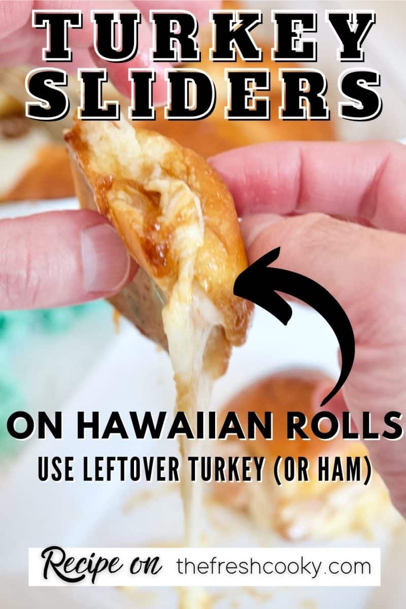 Hawaiian Roll Turkey Chicken Sliders with hands holding a gooey, melty cheese slider.