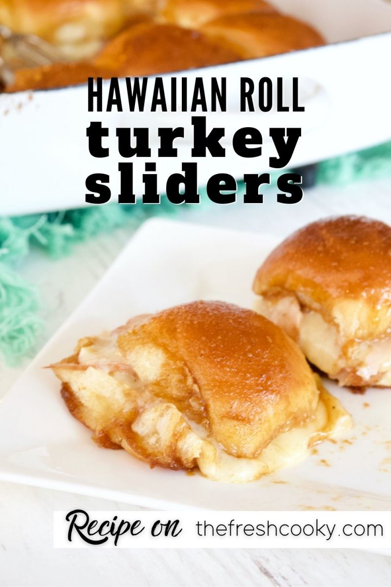 Pinterest image for Hawaiian Roll Turkey Sliders with two sliders on a plate and pan of sliders in background.