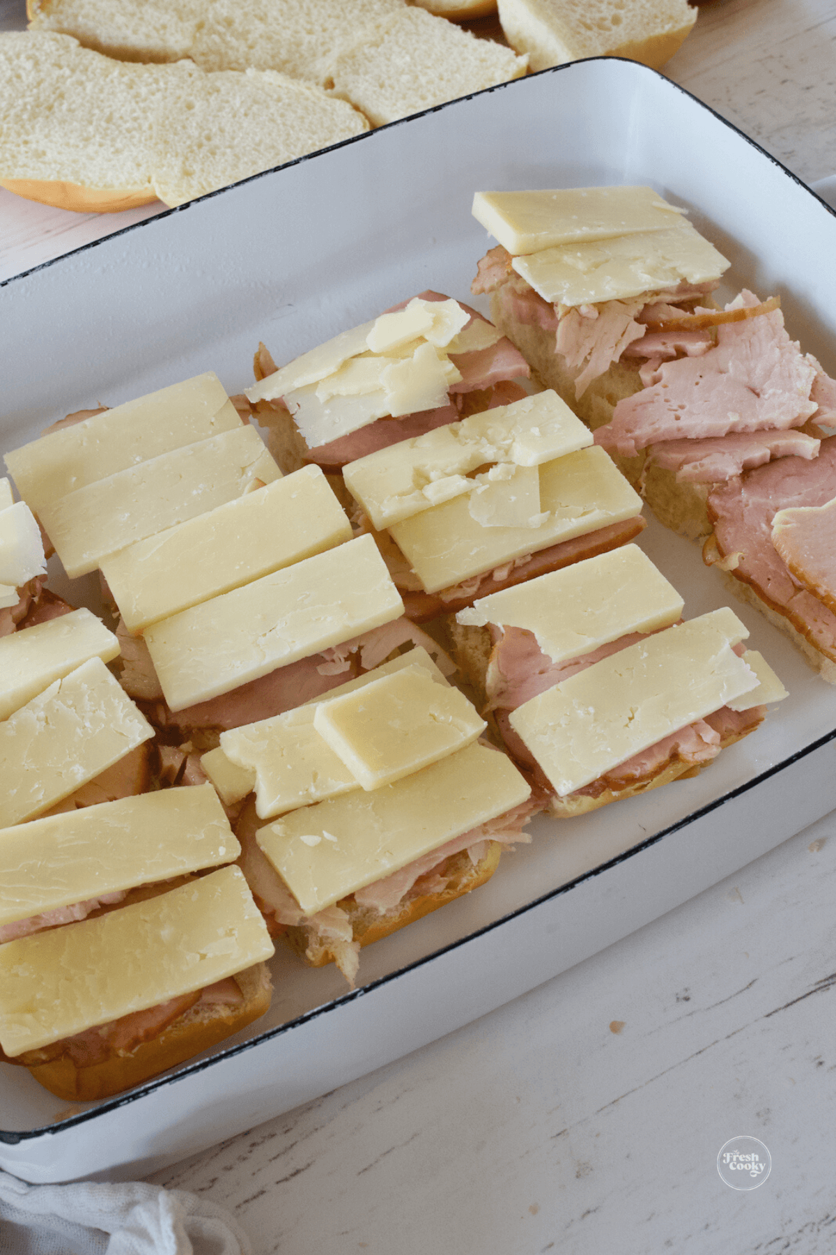 Turkey and cheddar laid out on sandwiches. 