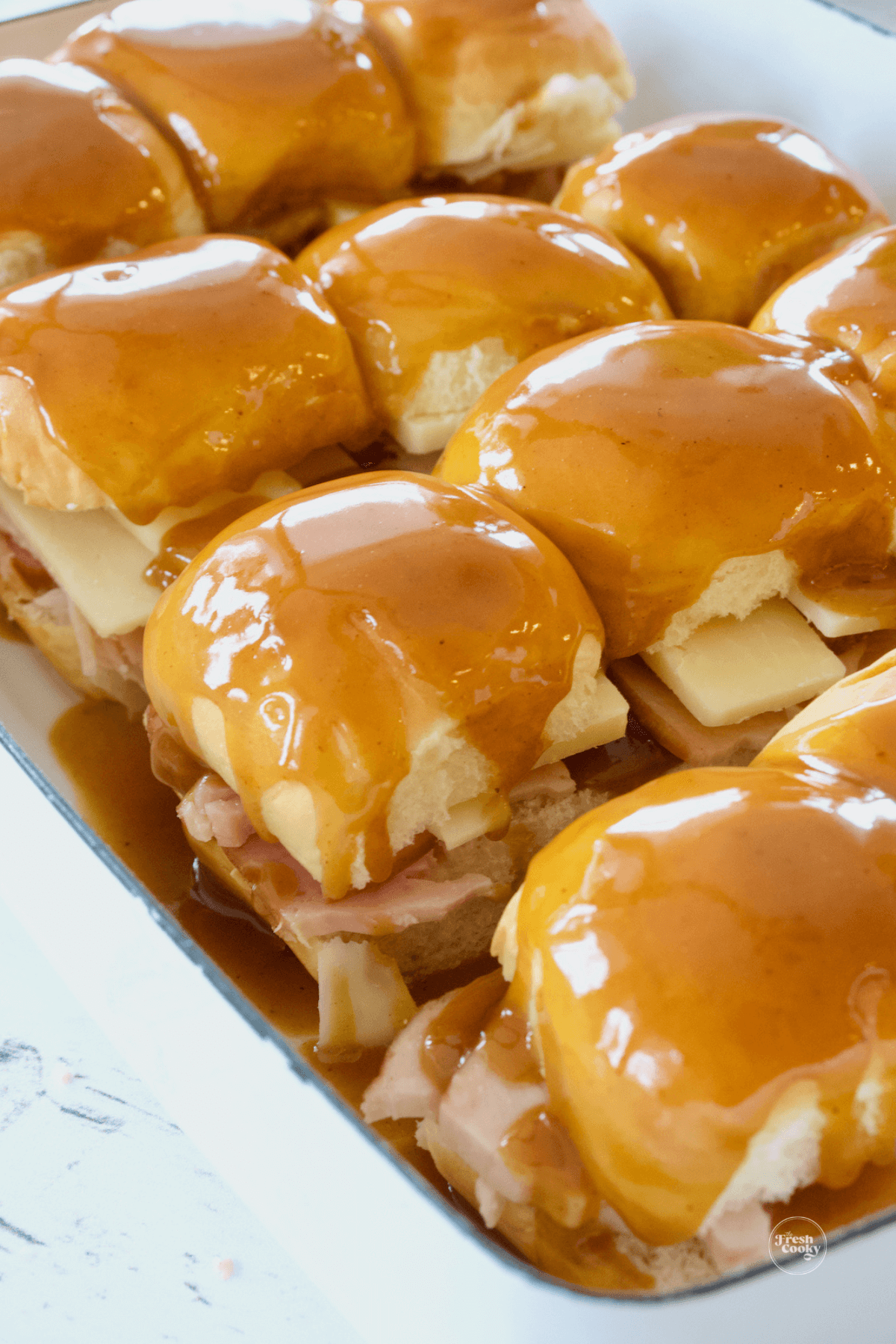 Sauce poured over tops of turkey sliders.