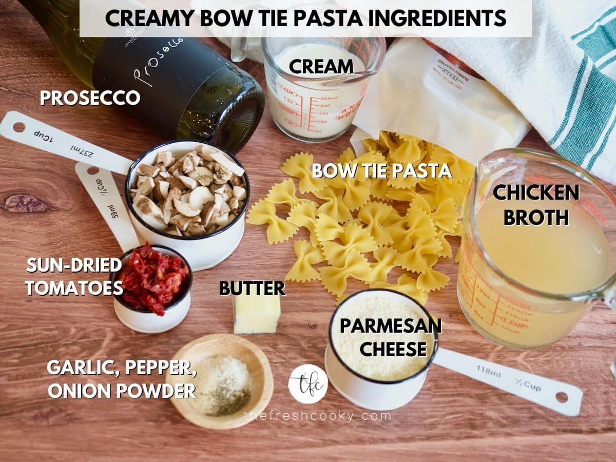 Ingredients for Creamy Bow Tie Pasta Recipe L-R mushrooms, prosecco, cream, chicken broth, bow tie pasta, parmesan cheese, butter, spices and sun-dried tomatoes.