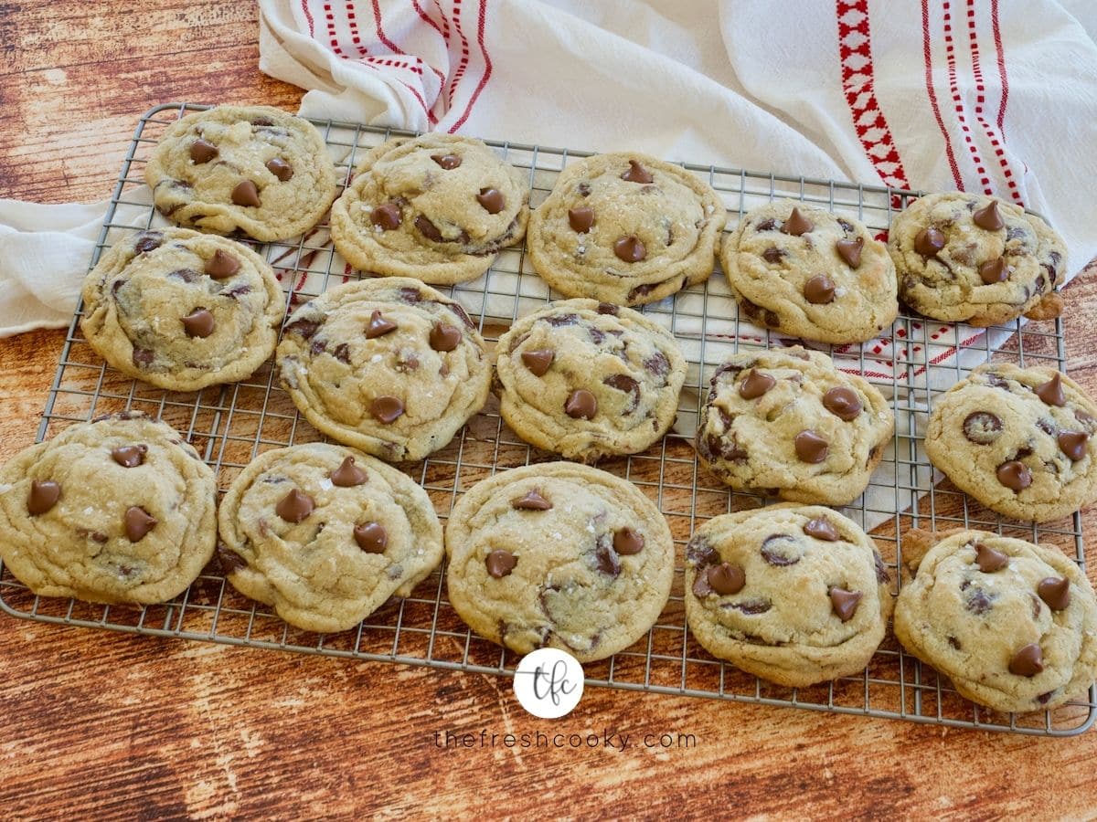 Cooling rack filled with gluten free chocolate chip cookies.