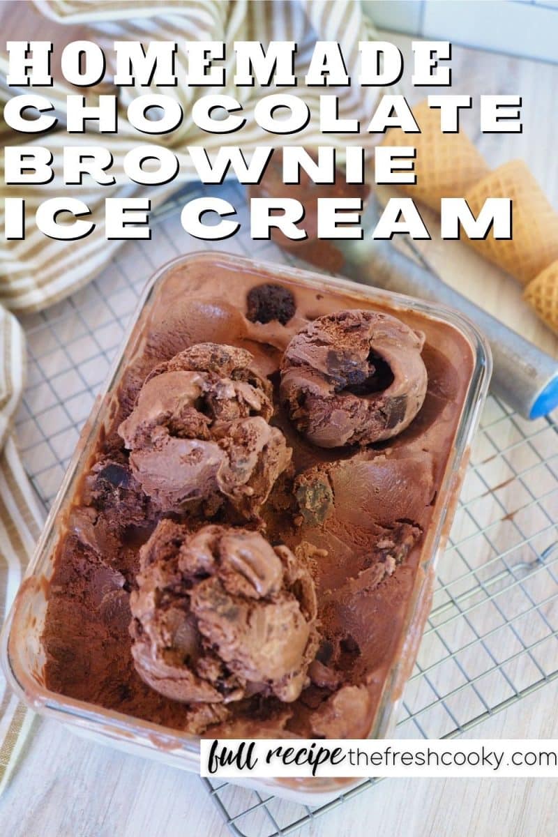 Homemade Chocolate Brownie Ice Cream, top down shot of container with scoops of fudge brownie ice cream on wire rack with sugar cones in background.