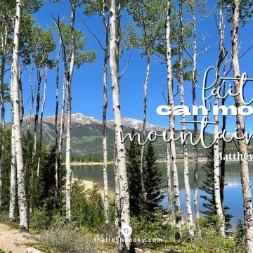Image of aspen trees a lake and mountains in the background with words faith can move mountains!