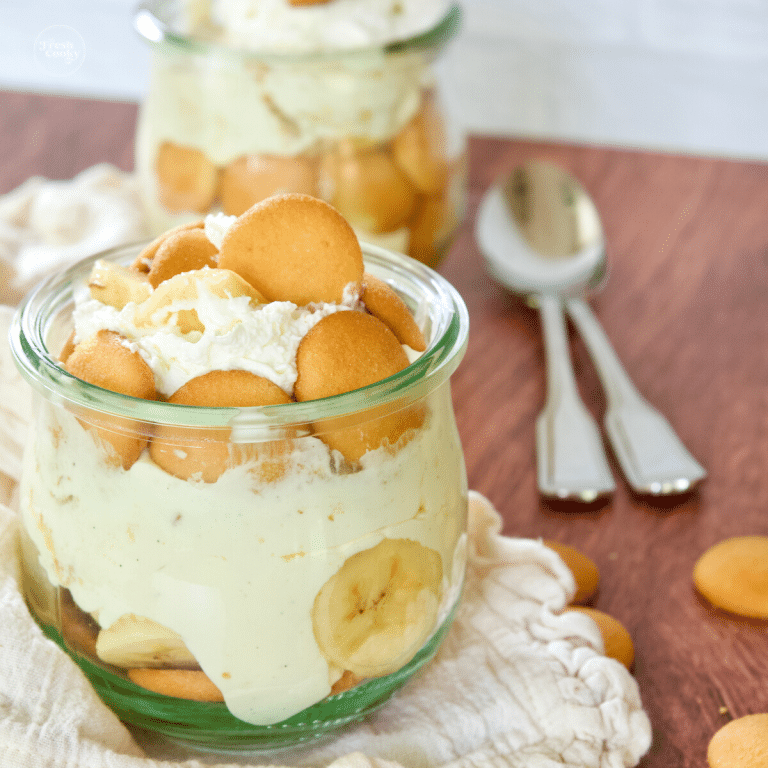 Square image of no bake banana pudding recipe layered in small single serving bowls.