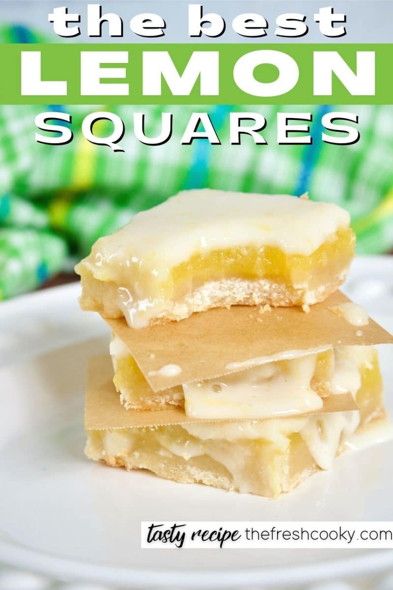 Image of three lemon squares, topped on each other with bite taken out of the top.