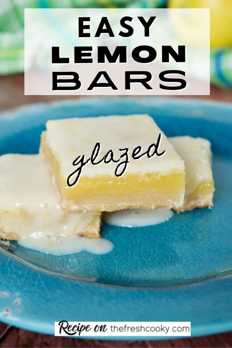 Easy Lemon Bars with tangy lemon glaze, image of three gooey lemon bars on blue plate with puddle of lemon glaze by one square.