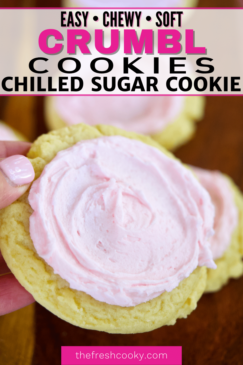 Pin for Crumbl Chilled Soft Sugar Cookies with hand holding a giant sugar cookie topped with light pink buttercream.