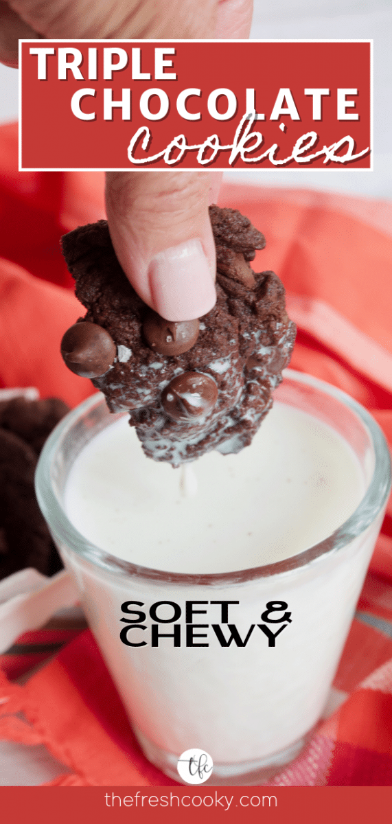 Long pin for triple chocolate cookies with hand holding a piece of a chocolate cookie dipped in a glass of cold milk.