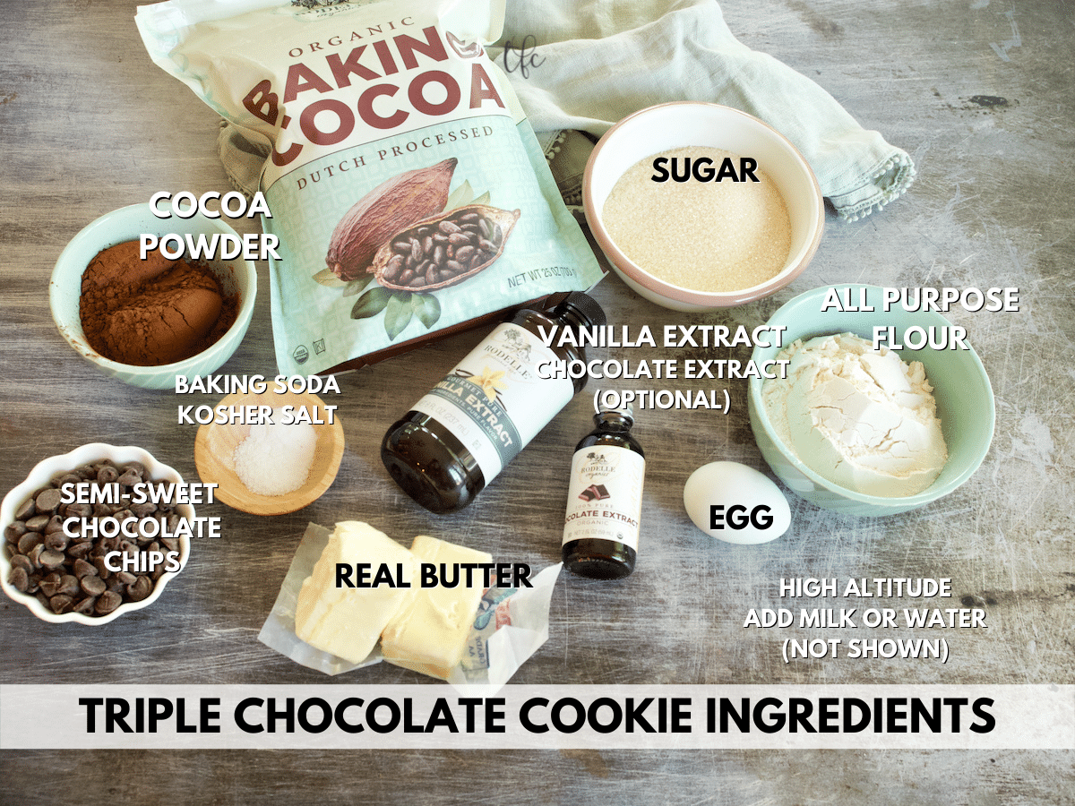 Ingredients for Triple Chocolate Cookies L-R Baking Cocoa powder, sugar, flour, egg, chocolate extract, vanilla extract, butter, salt, baking soda and chocolate chips.. 