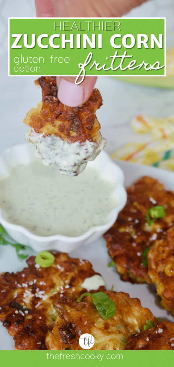 Healthy Zucchini Corn Fritters with hand holding a fritter that's been dipped in homemade ranch dressing.