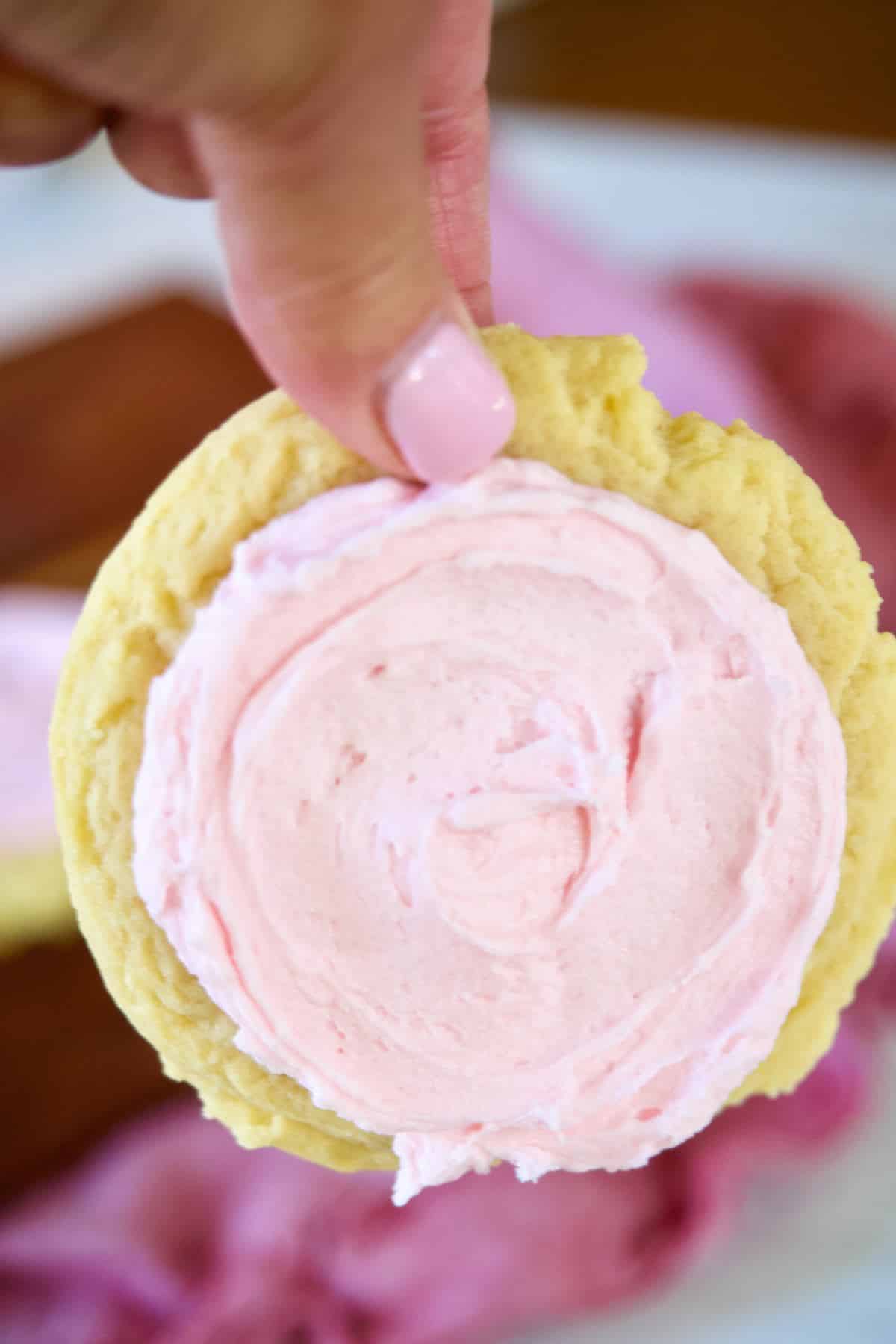 Copycat sugar cookie recipe being held by hand.