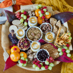 Fall Charcuterie Breakfast Grazing board top down shot with nibbles, yogurt, crackers and fruit Square image.