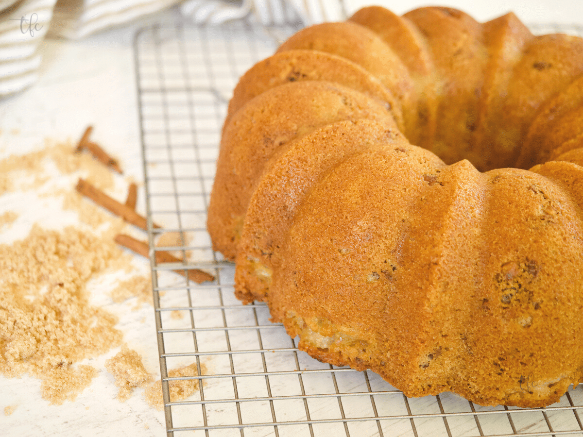 Pear bundt cake on wire cooling rack.