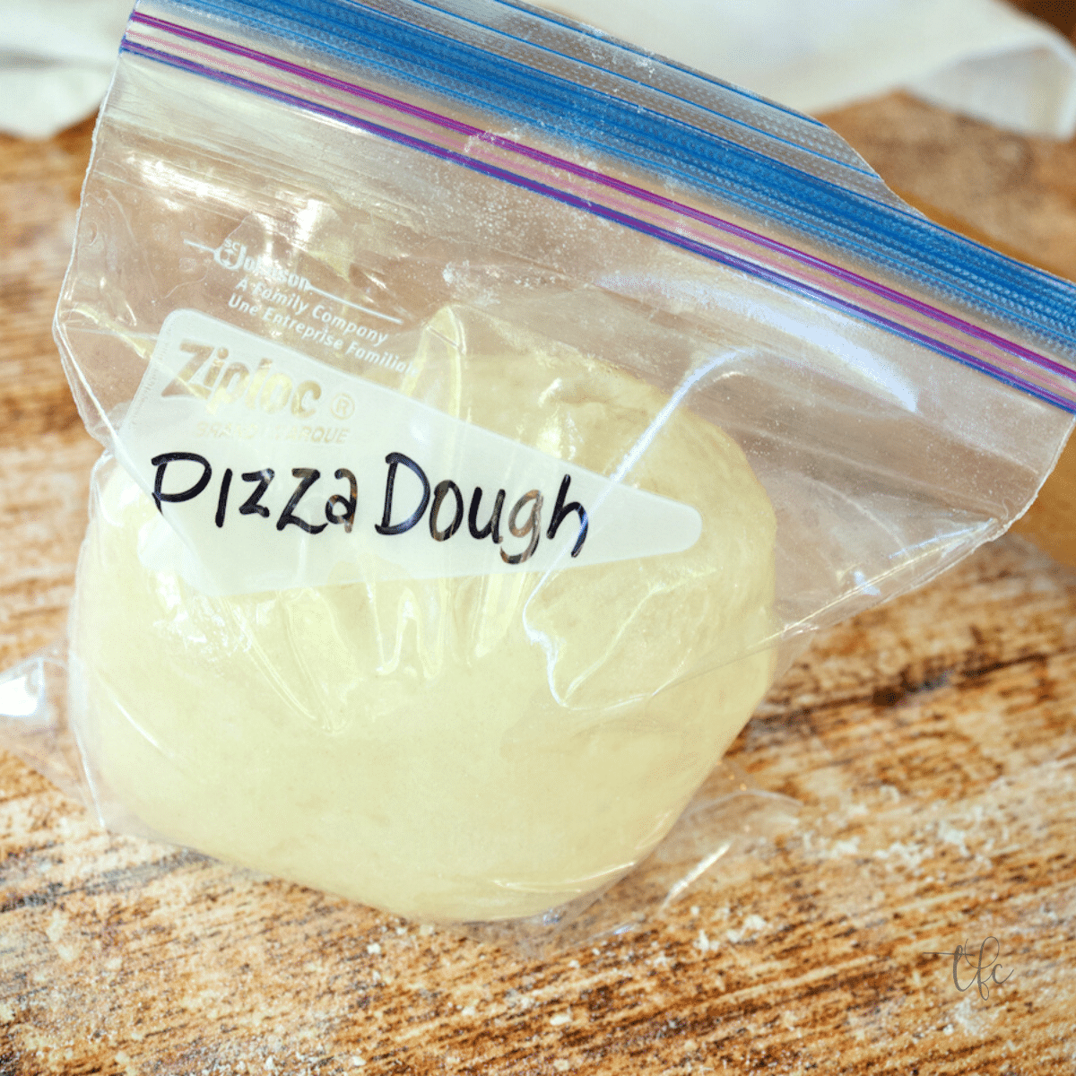 Pizza dough in a freezer baggie ready to be frozen.