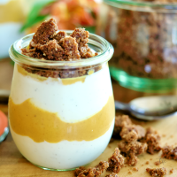 Pumpkin Yogurt in pretty jar with crunchies on top.