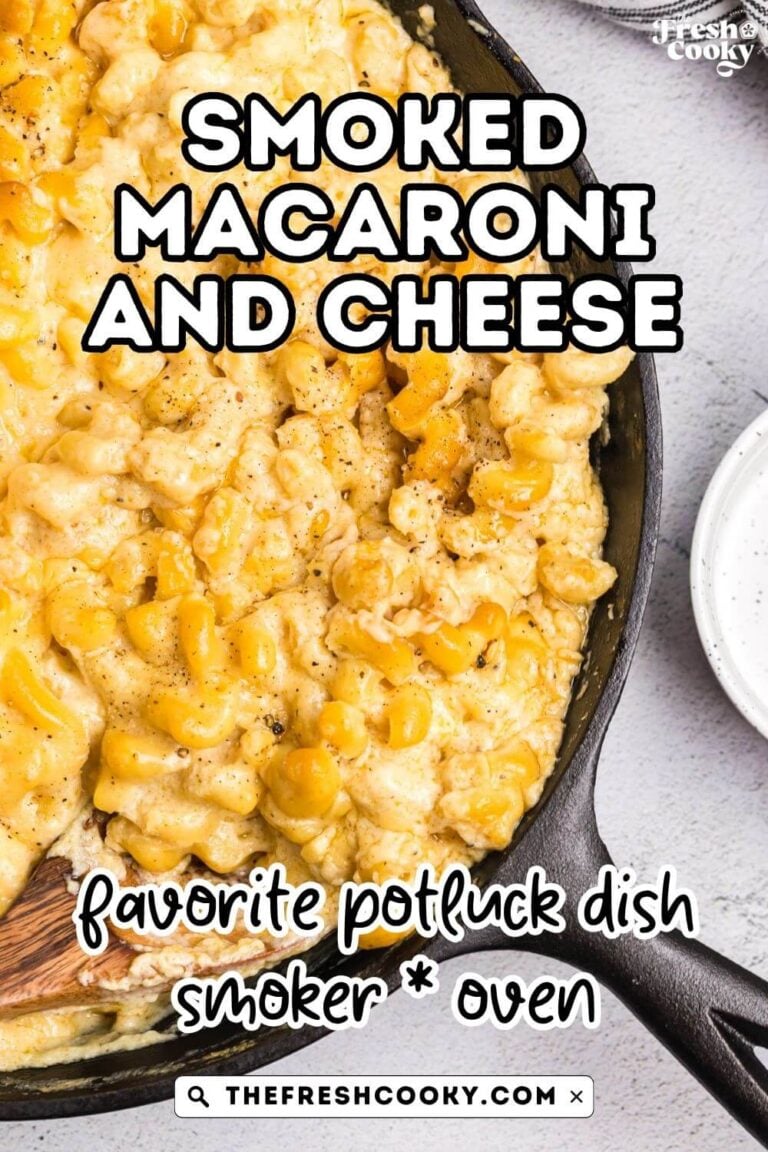 A cast iron skillet filled with creamy, cheesy smoker mac and cheese. To pin.
