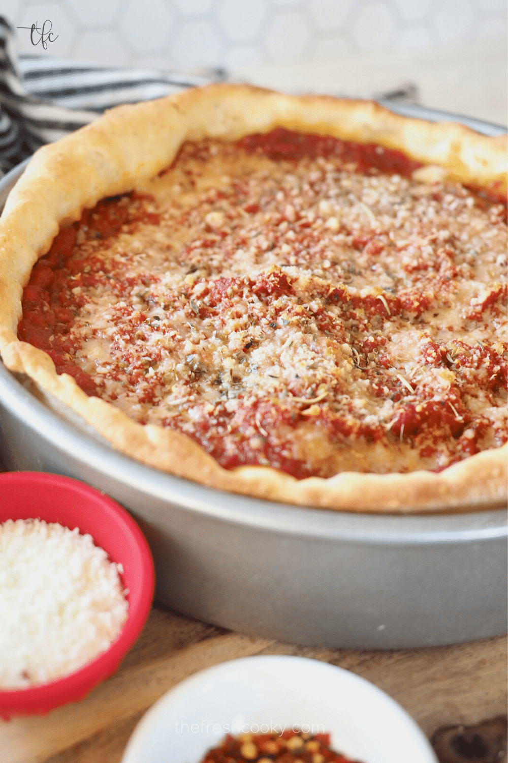 Chicago Deep dish pizza covered in a rich marinara sauce.