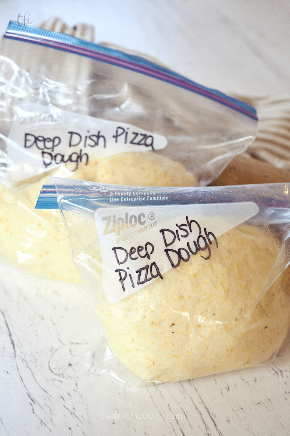 Deep Dish Pizza Dough Balls placed inside baggies for freezing.