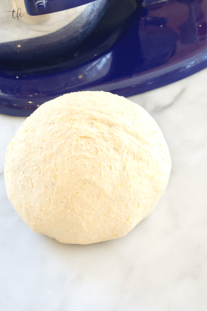Deep dish pizza dough formed into a ball for first rise. 