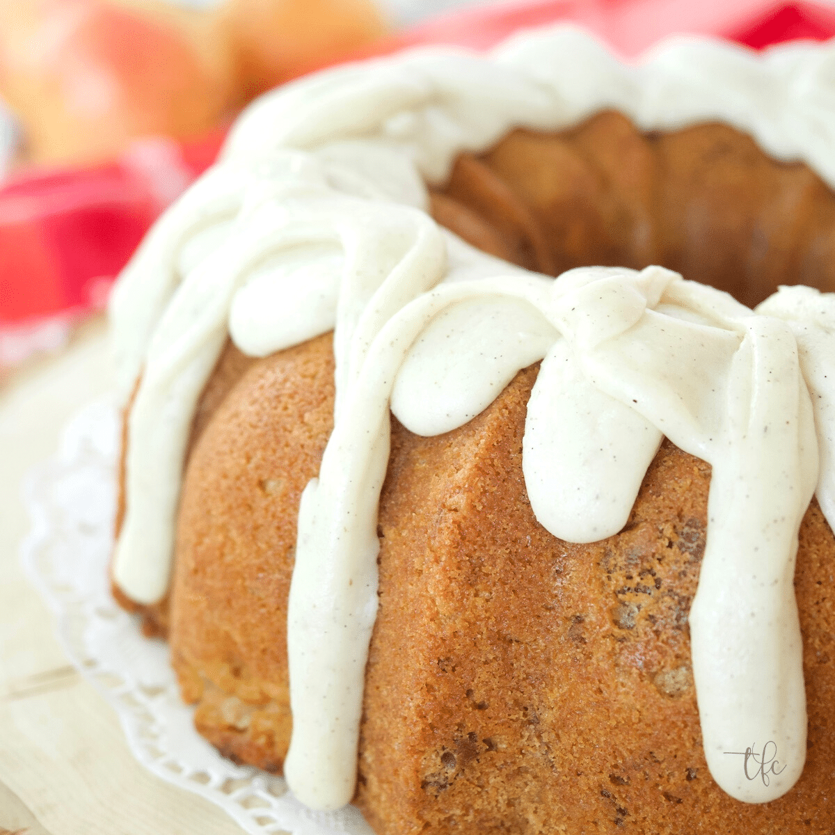 Pear Bundt Cake with thick buttercream glaze drizzled on top. 