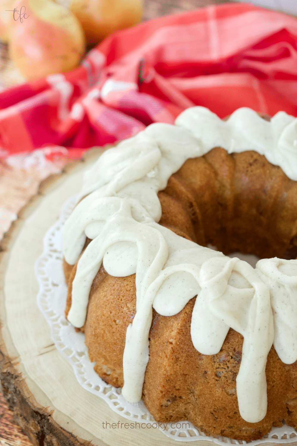 Image of glazed pear bundt cake with fingers of glaze dripping down the sides.