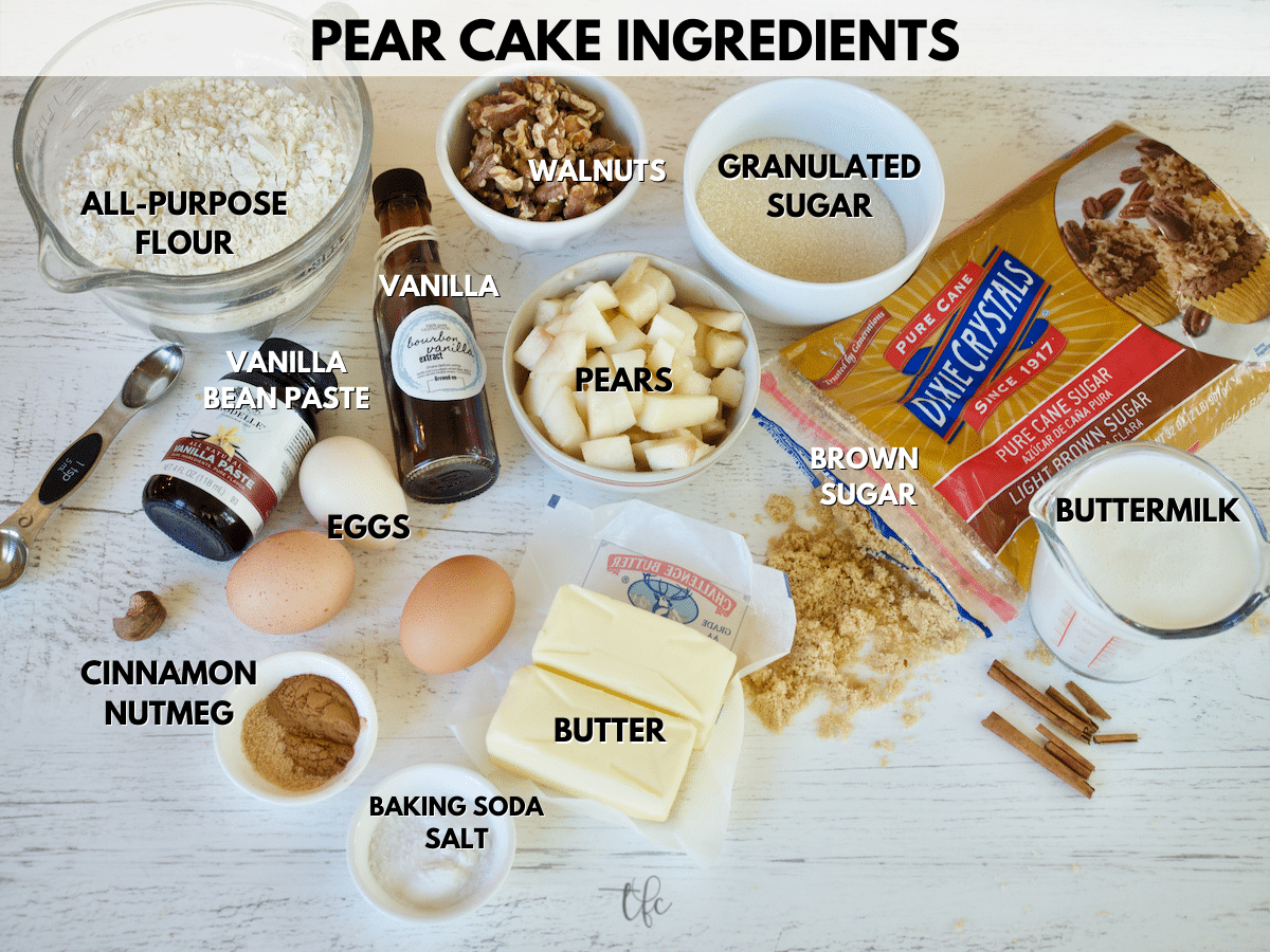 Pear Cake Ingredient shot from L-R all purpose flour, walnuts, granulated sugar, brown sugar, buttermilk, butter, baking soda, salt, cinnamon, nutmeg, vanilla bean paste, eggs, vanilla extract and pears.