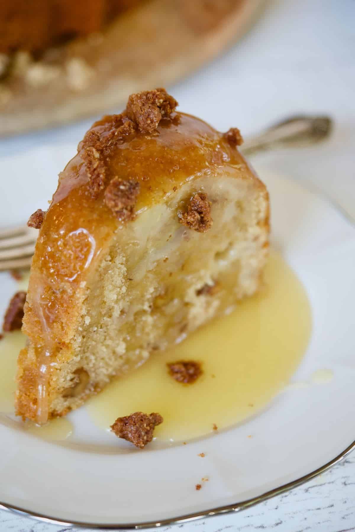 Vanilla sauce drizzled over pear bundt cake.