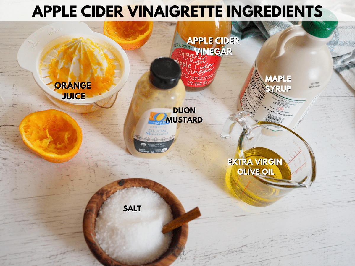 Apple Cider Vinaigrette ingredients L-R orange juice, apple cider vinegar, maple syrup, olive oil, Dijon mustard, salt.