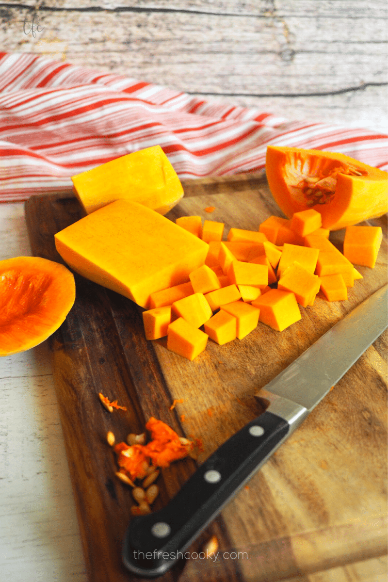 Chopping butternut squash for roasted butternut squash in harvest salad.