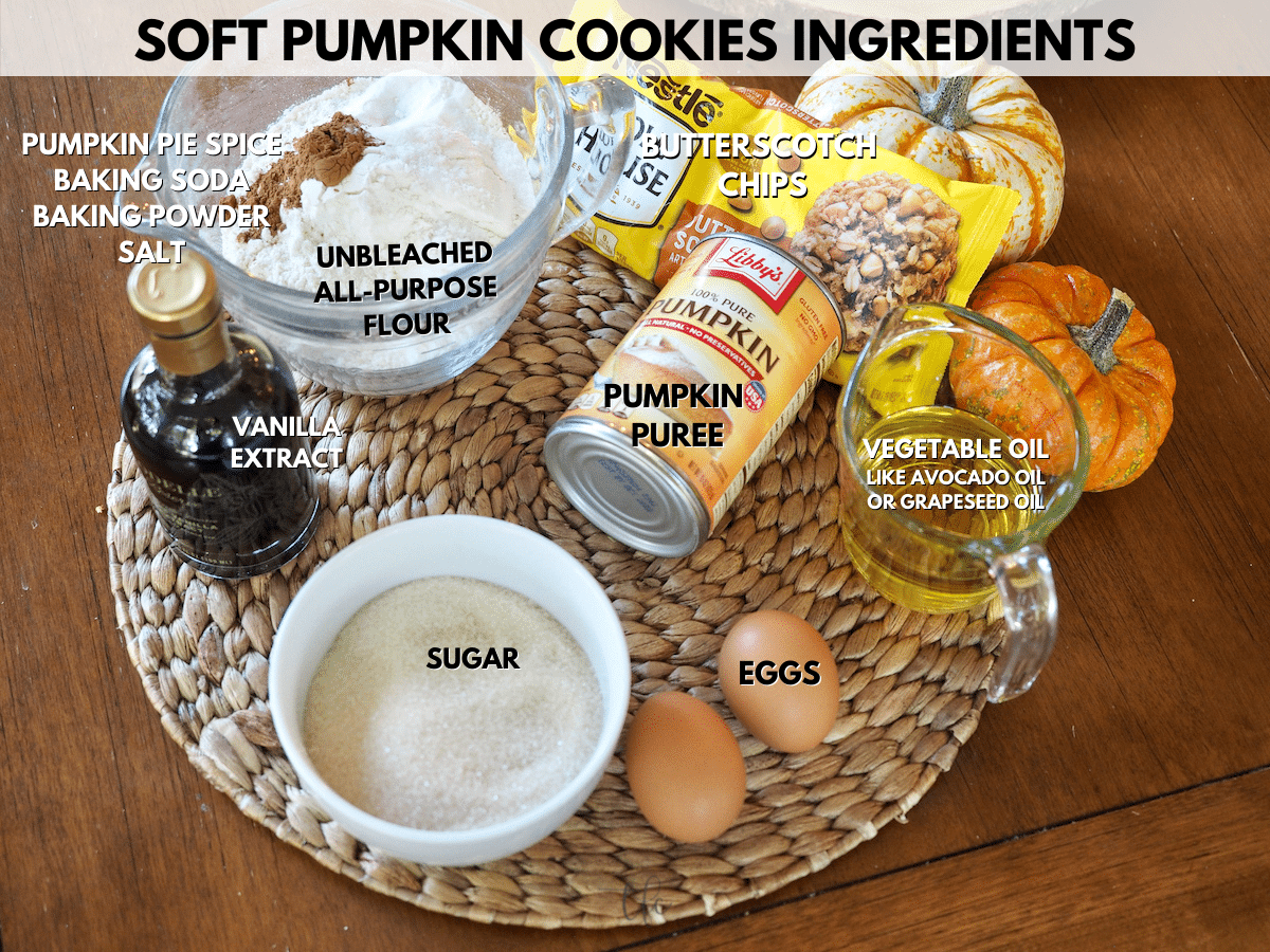 Soft Pumpkin Spiced Cookie ingredients L-R Vanilla, Flour, Baking powder and soda, salt, pumpkin pie spice, butterscotch chips, libby's canned pumpkin, oil, eggs and granulated sugar.