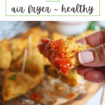 Pin for Air Fryer Toasted Ravioli with hand holding a dipped fried ravioli.