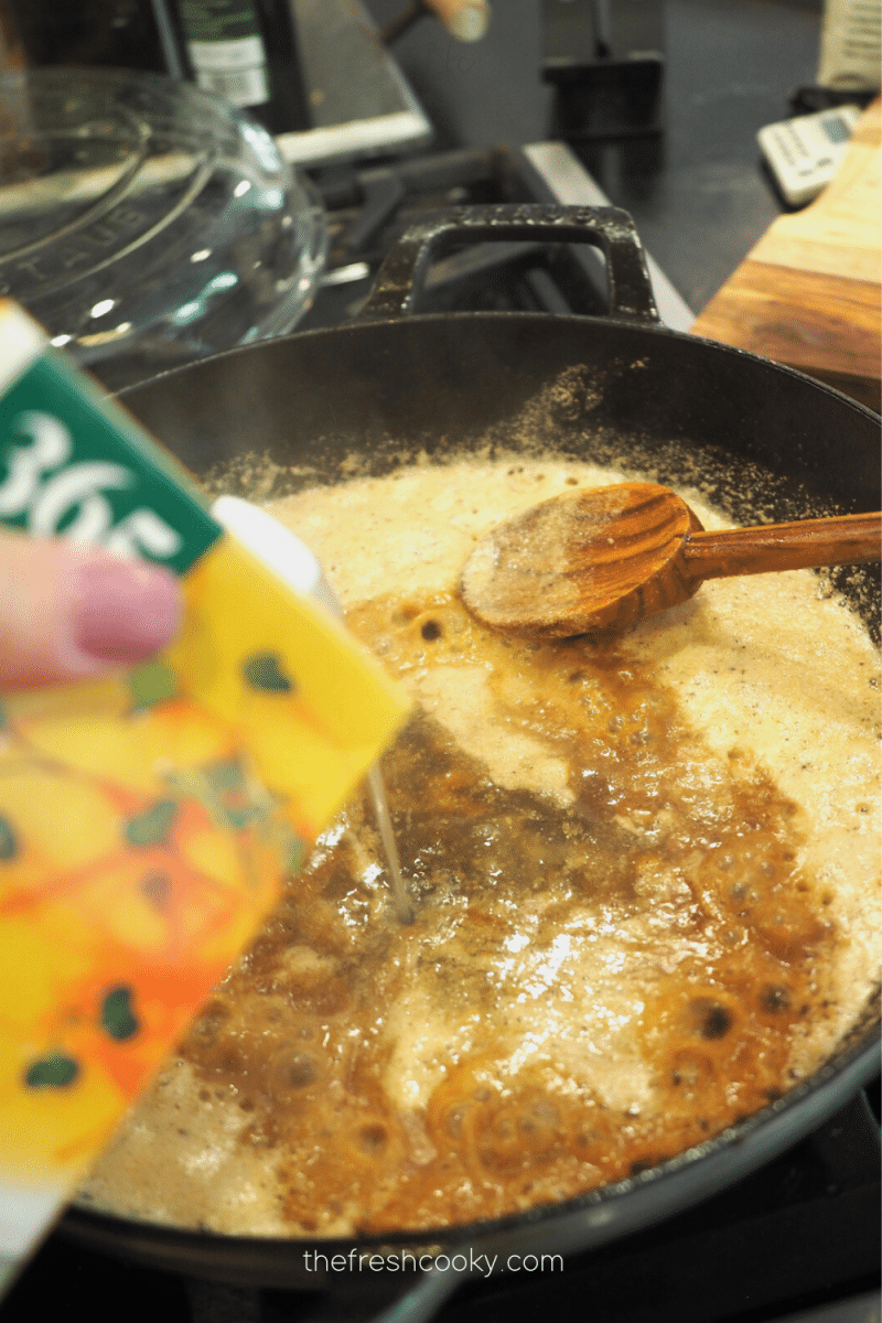 Adding chicken stock to flour and butter mixture for roux. 