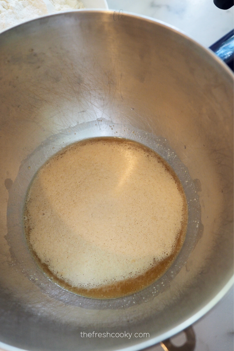 Bloomed yeast in mixing bowl ready to make pretzel bites. 