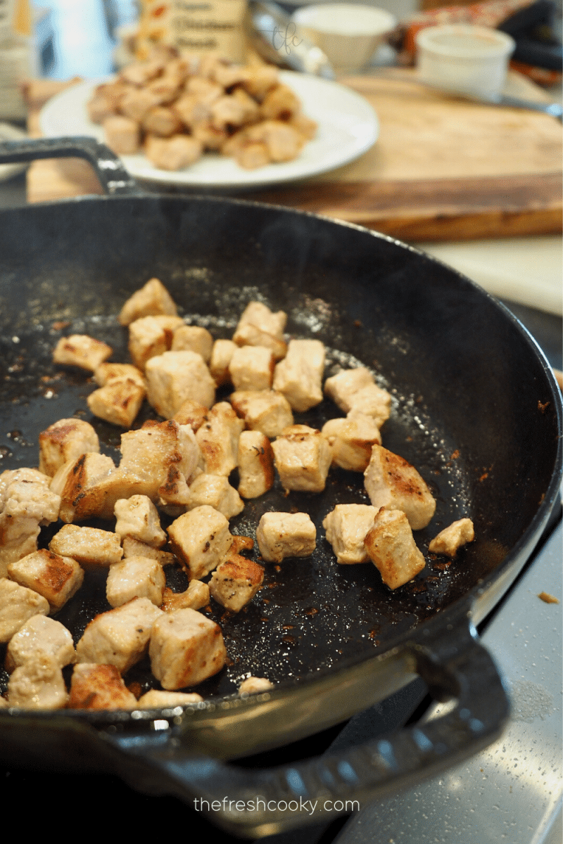 Searing and browning the diced pork for Green chile recipe. 