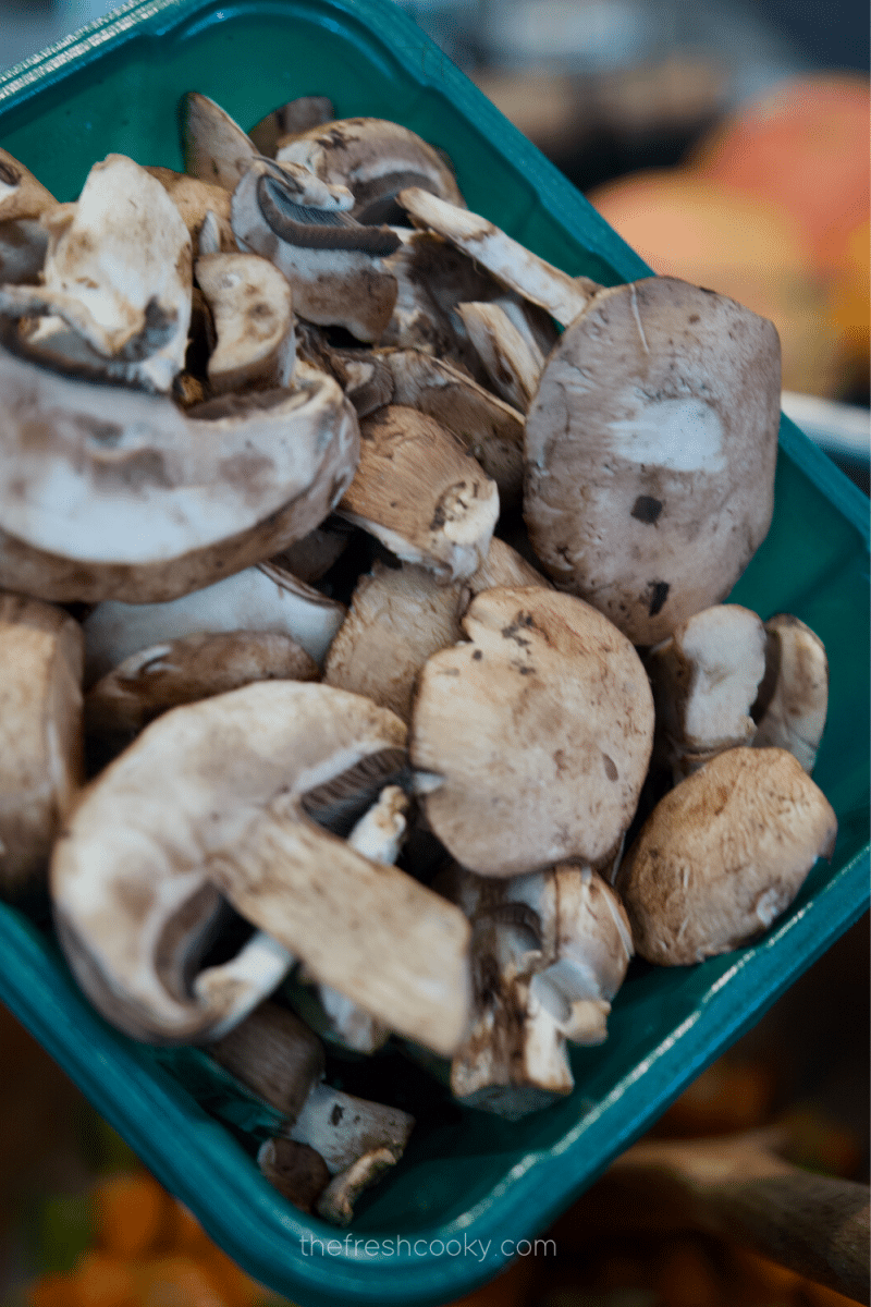 Adding mushrooms to Instant Pot for chicken and wild rice soup.