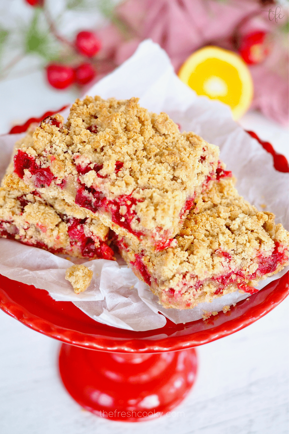 Oatmeal cranberry crunch bars on red platter.