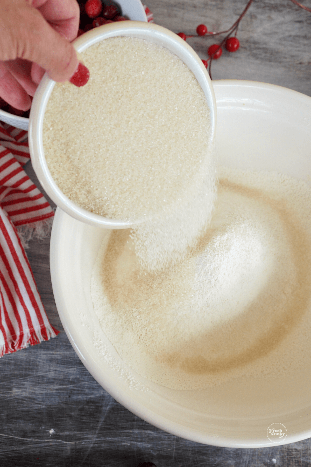 Combing sugar and flour in mixing bowl. 