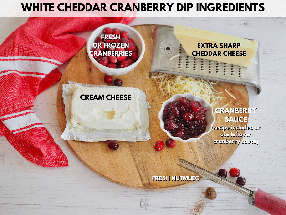 White Cheddar Cranberry Dip ingredient shot L-R Fresh cranberries, sharp white cheddar cheese, homemade cranberry sauce, nutmeg, cream cheese.
