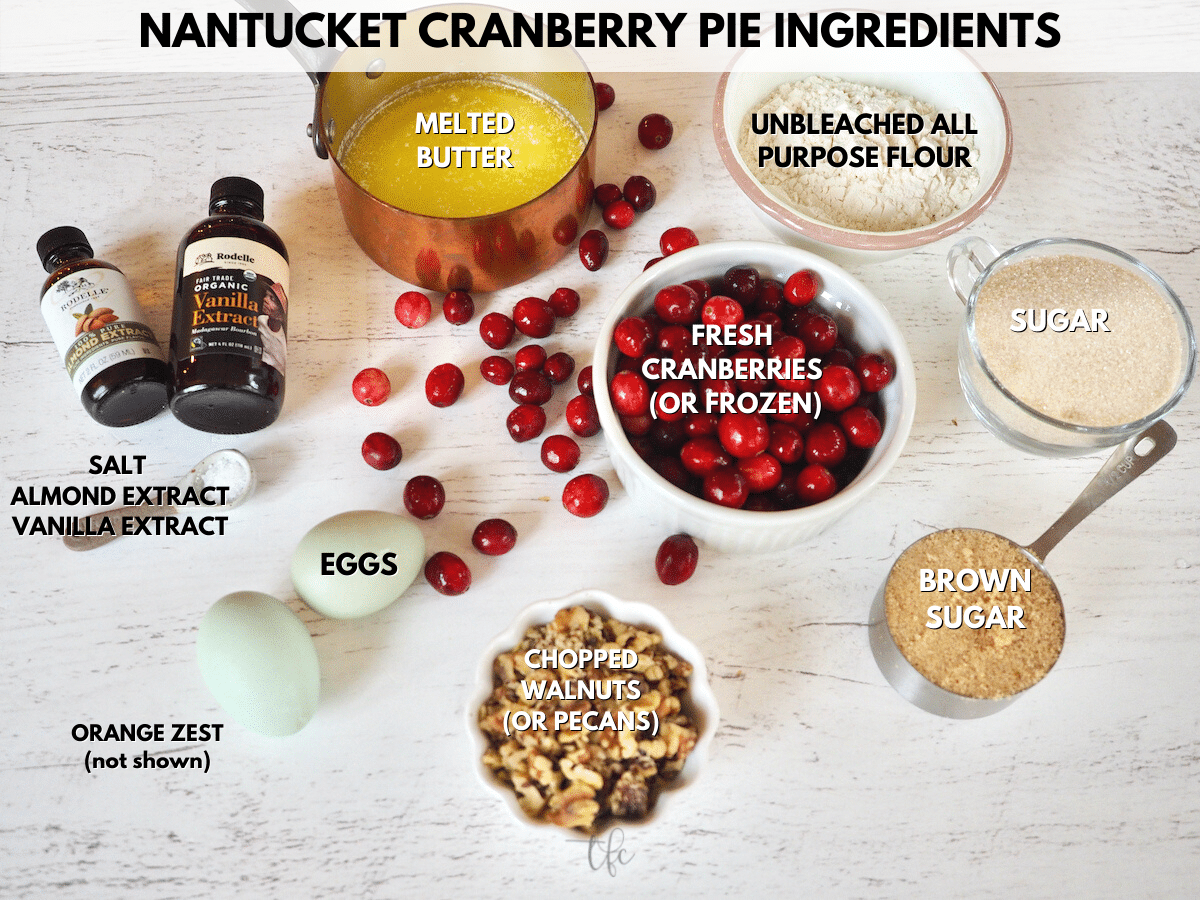Ingredients for Nantucket Cranberry Pie L-R almond extract, vanilla extract, melted butter, flour, sugar, brown sugar, walnuts, cranberries, eggs and salt.