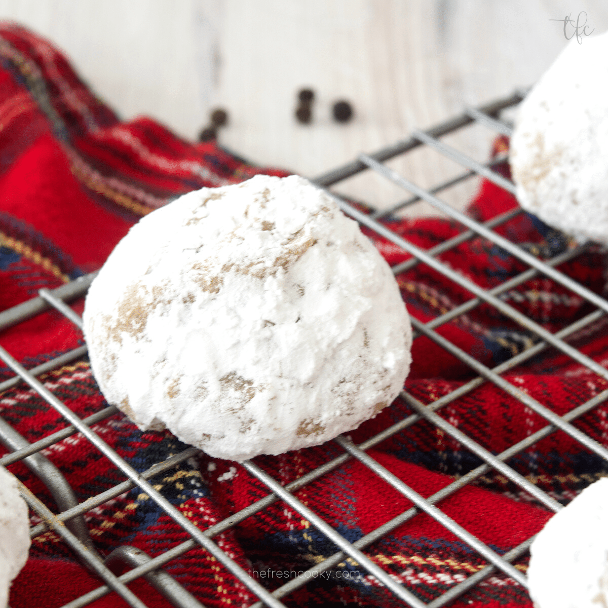 Spiced German Cookie, Pfeffernusse single cookie on wire cooling rack.