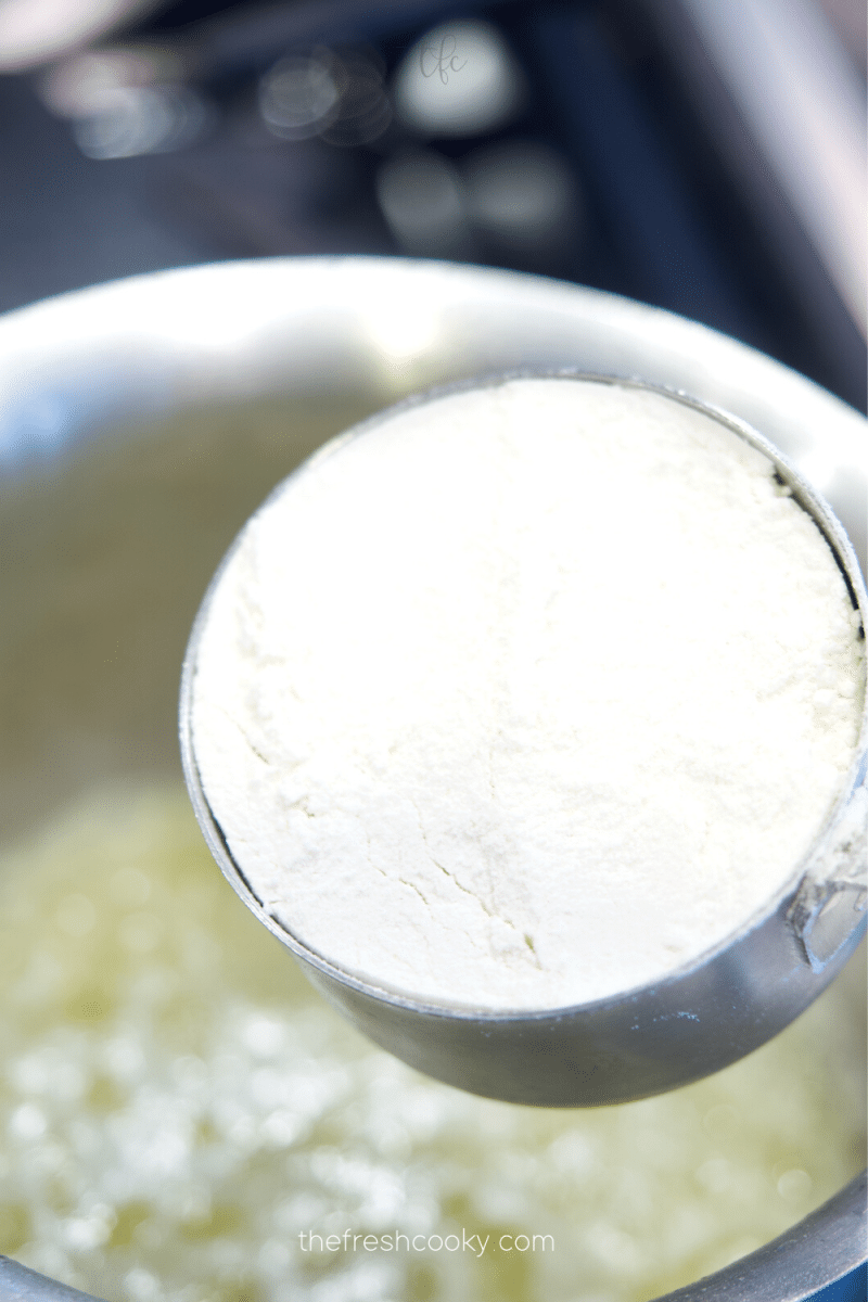 Add flour to melted butter, whisking constantly. 