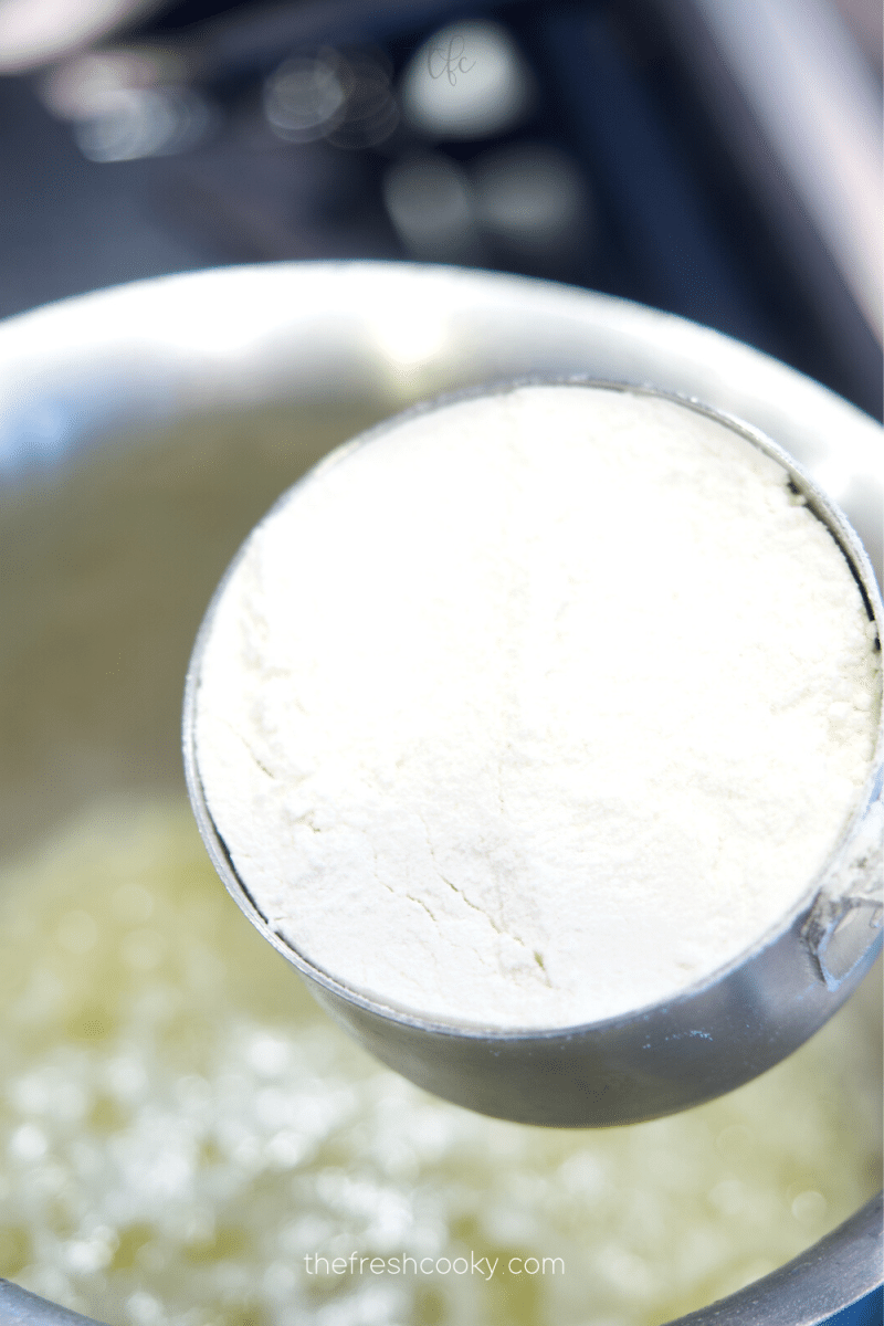 Add flour to melted butter, whisking constantly.