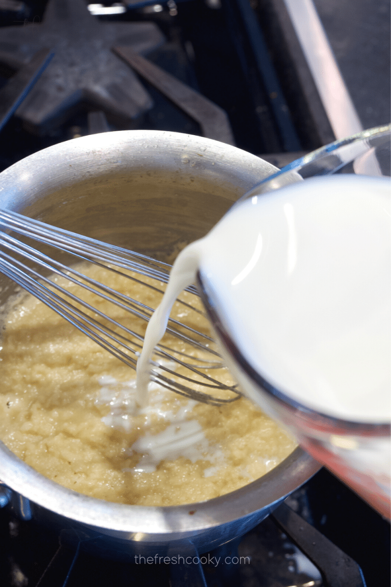 Whisking constantly, slowly pour the milk into the flour and butter and stir until thick and bubbly. 