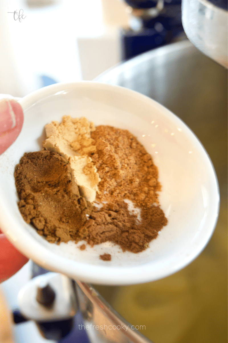 Adding warm spices to sugar and eggs batter. For Pfeffernusse cookies. 