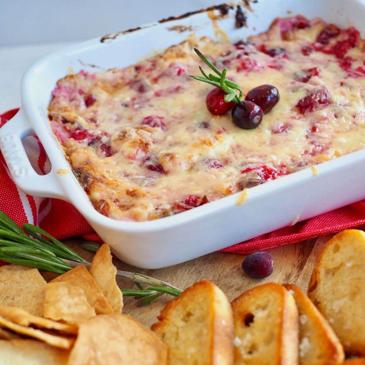 Hot and cheesy, cranberry cream cheese dip with white cheddar cheese.