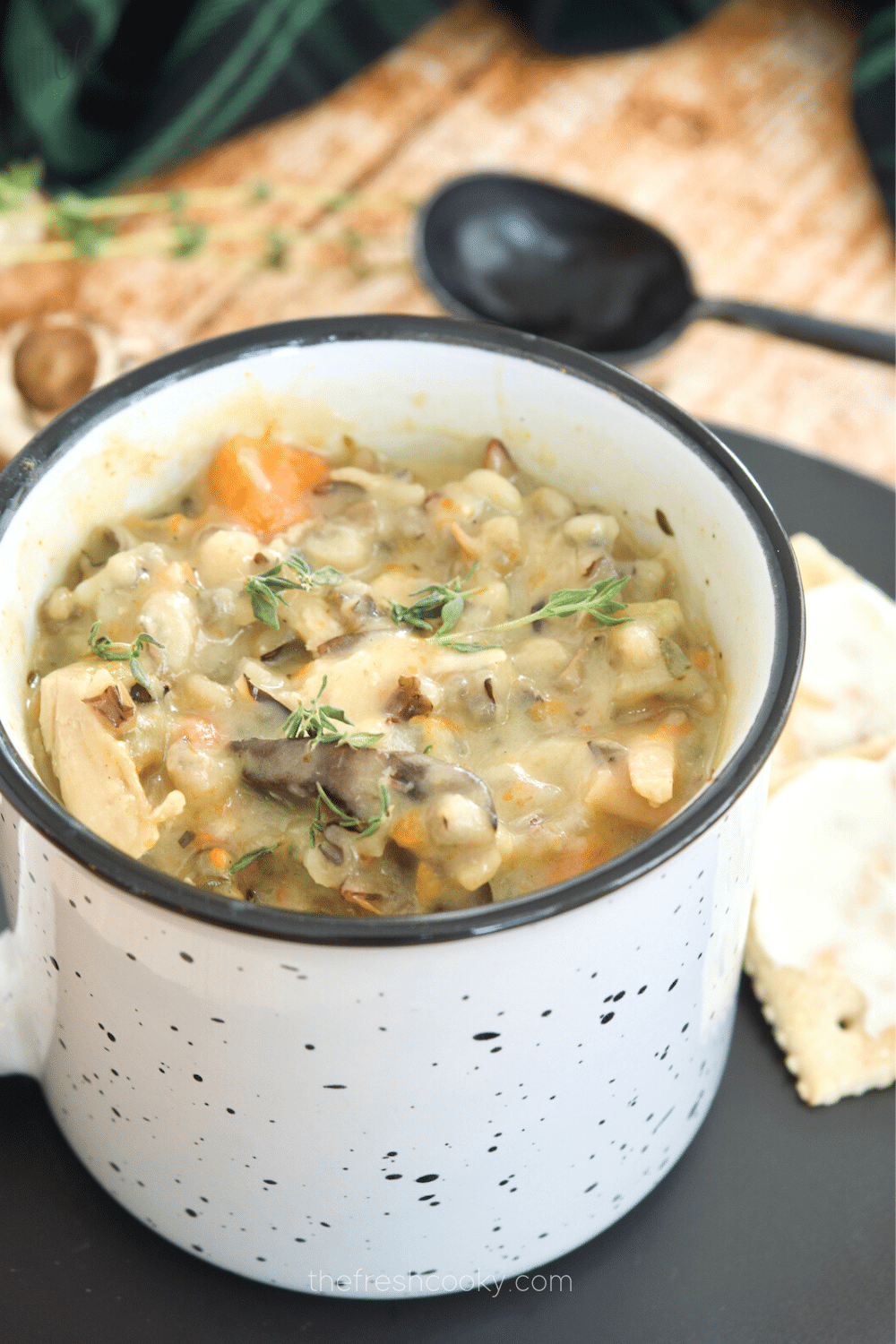 Closeup of mug filled with copycat Panera Creamy Chicken and Wild Rice Soup.