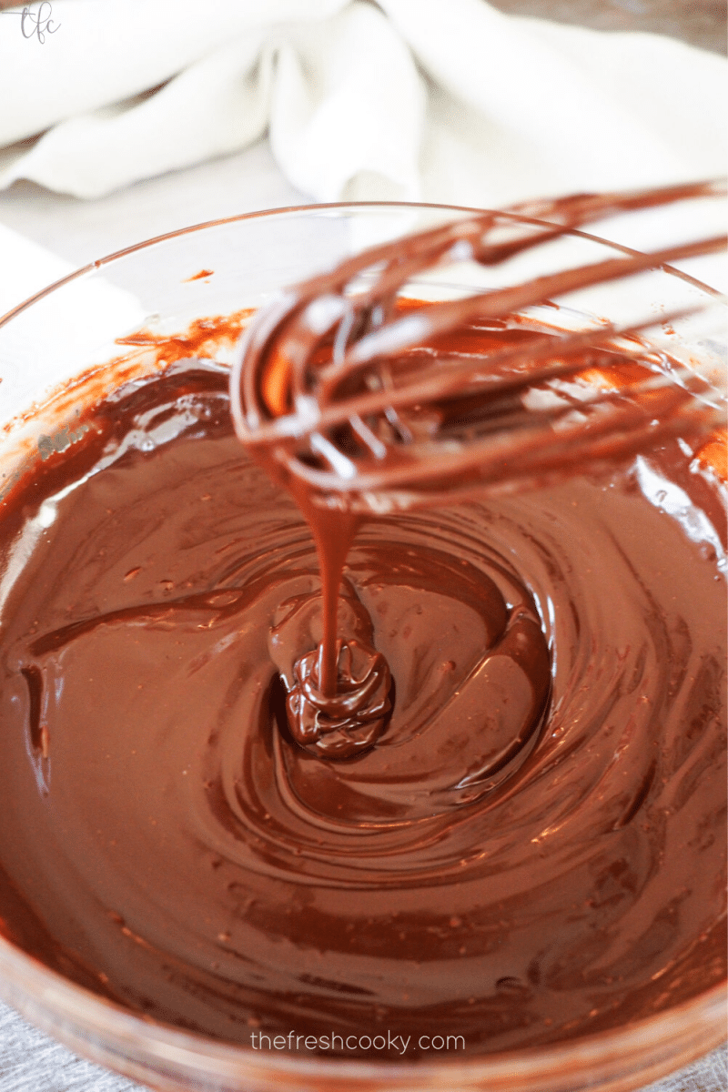 After whisking smooth, creamy chocolate ganache ready for champagne for chocolate truffles. 